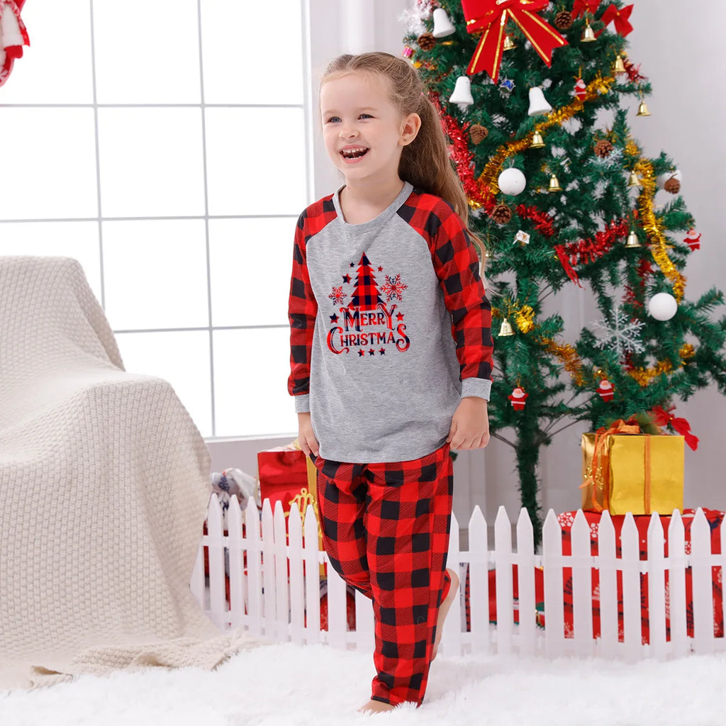 Matching Christmas pyjamas with tree and plaid print