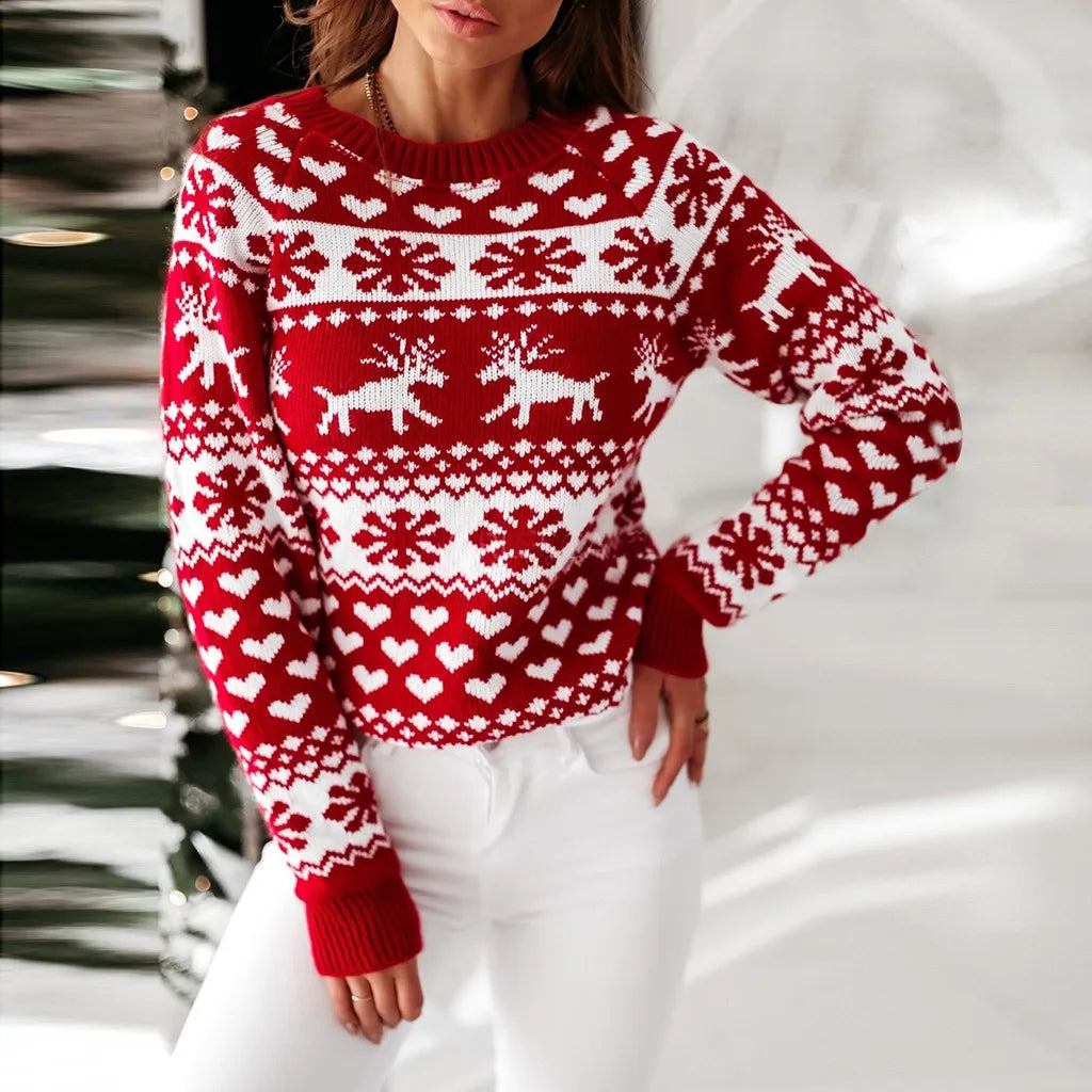 Women’s Christmas sweater featuring reindeer in red, white knitted design