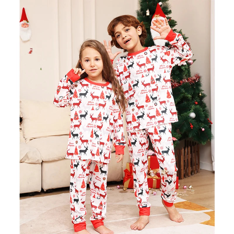 Matching holiday pyjamas with Christmas tree print