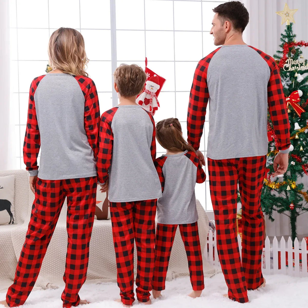 Matching holiday pyjamas featuring festive tree plaid
